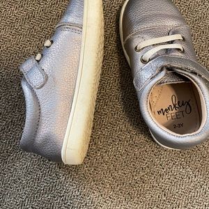 Silver monkey feet shoes